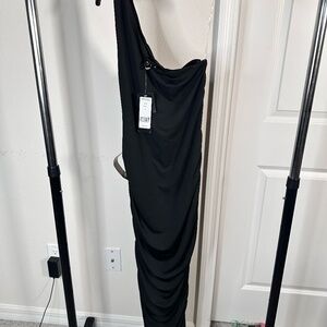 Bebe One shoulder body con Midi  black dress in size Medium.